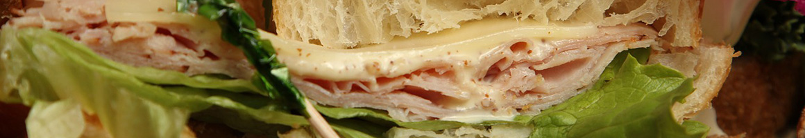 Eating Sandwich at Sam's Bagels restaurant in Baltimore, MD.